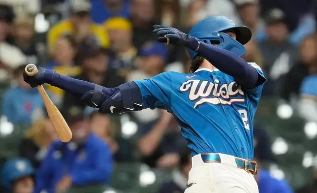 Milwaukee Brewers' Brice Turang hits an RBI double during the first inning of a baseball game against the St. Louis Cardinals, Friday, Sept. 25, 2026, in Milwaukee. (AP Photo/Aaron Gash)