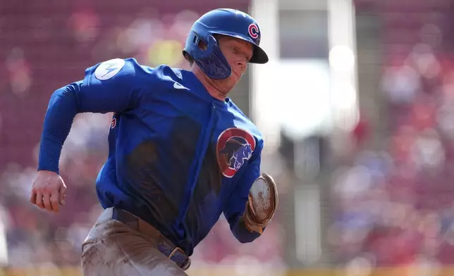 Chicago Cubs' Pete Crow-Armstrong rounds third base on his way to scoring during the first inning of a baseball game against the Cincinnati Reds, Sunday, Sept. 20, 2026, in Cincinnati. (AP Photo/Kareem Elgazzar)