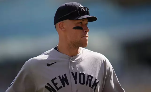 New York Yankees' Aaron Judge walks back to the dugout after the bottom of the fourth inning of a baseball game against the Minnesota Twins, Wednesday, Sept. 16, 2026, in Minneapolis. (AP Photo/Abbie Parr)
