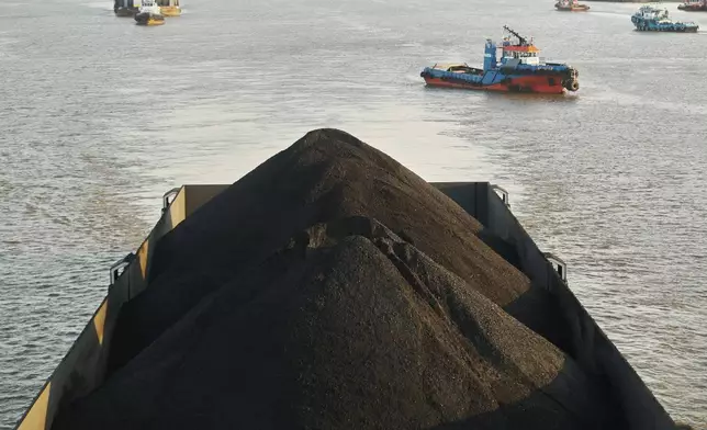A barge is fully loaded with coal on the Mahakam River in Samarinda, East Kalimantan, Indonesia, on Aug. 19, 2026. (AP Photo/Ahmad Mulia Panjaitan)