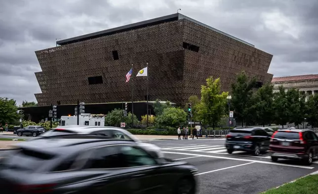 Cars drive past Smithsonian's National Museum of African American History and Culture, Wednesday, Sept. 23, 2026, in Washington. (AP Photo/Julia Demaree Nikhinson)