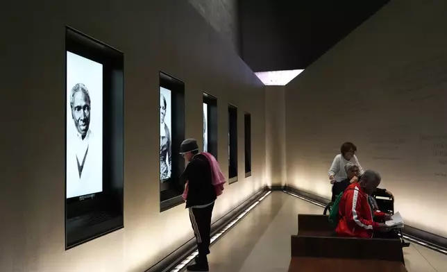 People visit the Smithsonian's National Museum of African American History and Culture, Wednesday, Sept. 23, 2026, in Washington. (AP Photo/Julia Demaree Nikhinson)