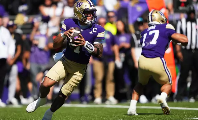 Washington quarterback Demond Williams Jr. looks to throw against Washington State during the first half of an NCAA college football game, Sunday, Sept. 6, 2026, in Seattle. (AP Photo/Lindsey Wasson)