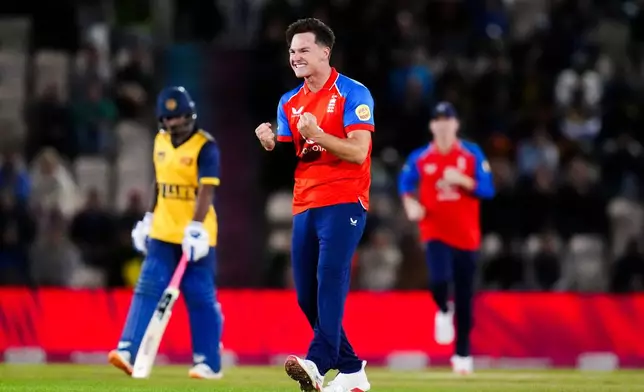 England's Sonny Baker celebrates the wicket of Sri Lanka's Kamil Mishara during the first IT20 match between England and Sri Lanka in Southampton, England, Tuesday Sept. 15, 2026. (John Walton/PA via AP)