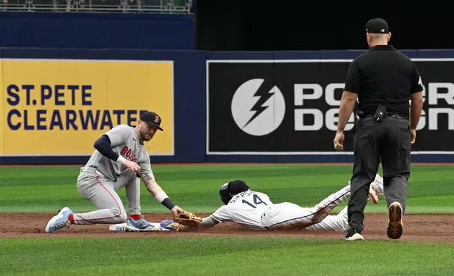 Tampa Bay Rays' Chandler Simpson (14) steals second base as Boston Red Sox shortstop Trevor Story, left, is late with the tag during the first inning of a baseball game, Sunday, Sept. 20, 2026, in St. Petersburg, Fla. (AP Photo/Phelan M. Ebenhack)