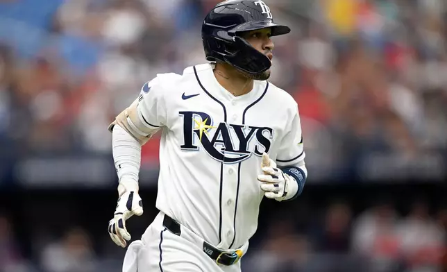 Tampa Bay Rays' Victor Mesa Jr. watches his solo home run during the fourth inning of a baseball game against the Boston Red Sox, Sunday, Sept. 20, 2026, in St. Petersburg, Fla. (AP Photo/Phelan M. Ebenhack)