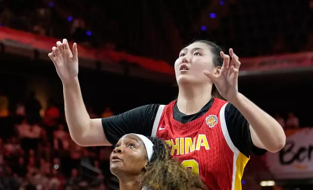 United States' Kiki Iriafen blocks China's Zhang Ziyu during the Women's Basketball World Cup match between China and the United States in Berlin, Friday, Sept. 4, 2026. (AP Photo/Ebrahim Noroozi)