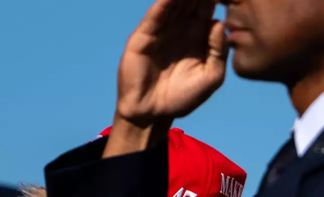 President Donald Trump is saluted by a U.S. Airman while boarding Air Force One at Morristown Airport, Monday, Sept. 7, 2026, in Morristown, N.J. (AP Photo/Julia Demaree Nikhinson)