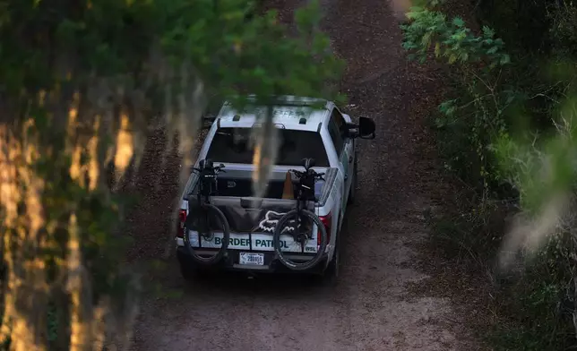 A U.S. Border Patrol vehicle passes through the Santa Ana Wildlife Refuge in Alamo, Texas, Monday, Aug. 24, 2026. (AP Photo/Eric Gay)