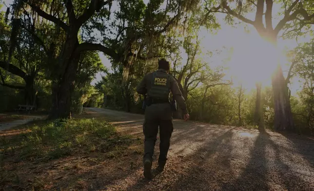 A U.S. Border Patrol agent passes through the Santa Ana Wildlife Refuge in Alamo, Texas, Tuesday, Aug. 25, 2026. (AP Photo/Eric Gay)
