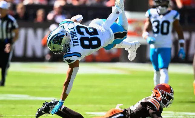 Cleveland Browns cornerback Mekhi Blackmon (29) tackles Carolina Panthers tight end Tommy Tremble (82) during the first half of an NFL football game in Cleveland, Sunday, Sept. 27, 2026. (AP Photo/David Richard)