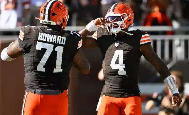 Cleveland Browns quarterback Deshaun Watson (4) celebrates after throwing for a 2-point conversion against the Carolina Panthers during the second half of an NFL football game in Cleveland, Sunday, Sept. 27, 2026. (AP Photo/David Richard)