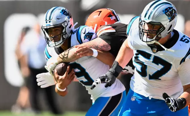 Cleveland Browns defensive tackle Mason Graham (94) sacks Carolina Panthers quarterback Bryce Young (9) during the first half of an NFL football game in Cleveland, Sunday, Sept. 27, 2026. (AP Photo/David Richard)