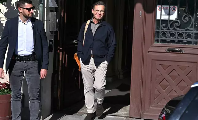 Swedish Prime Minister Ulf Kristersson leaves the official residence, Sager House, in Stockholm, a day after the vote in a general election, Monday, Sept. 14, 2026. (Claudio Bresciani/TT News Agency via AP)
