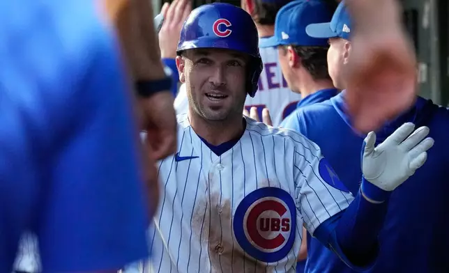Chicago Cubs' Alex Bregman, center, celebrates with teammates after hitting a two-run home run during the first inning of a baseball game against the Milwaukee Brewers in Chicago, Wednesday, Sept. 2, 2026. (AP Photo/Nam Y. Huh)