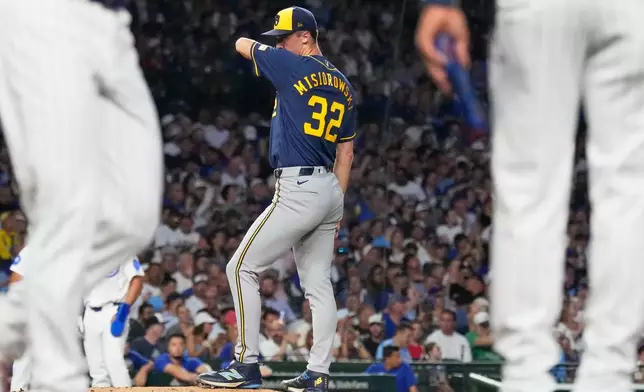 Milwaukee Brewers starting pitcher Jacob Misiorowski wipes his face after Chicago Cubs' Seiya Suzuki of Japan, walked to first during the second inning of a baseball game in Chicago, Wednesday, Sept. 2, 2026. (AP Photo/Nam Y. Huh)