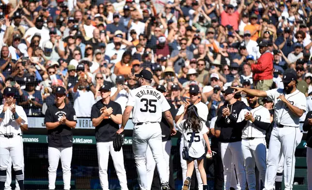 Detroit Tigers starting pitcher Justin Verlander (35) and his daughter, Genevieve Verlander, leave the field after Verlander was taken out of the game during the sixth inning of a baseball game against the Pittsburgh Pirates, Saturday, Sept. 26, 2026, in Detroit. (AP Photo/Jose Juarez)