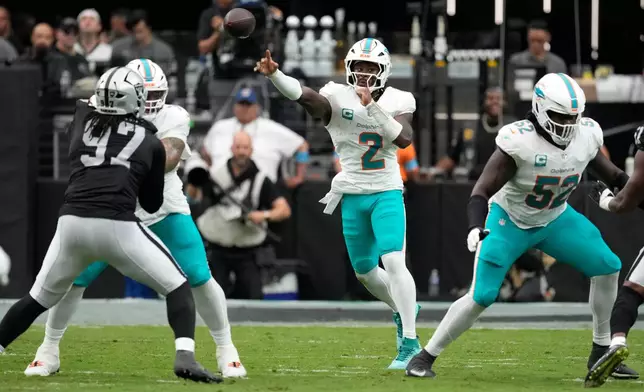 Miami Dolphins quarterback Malik Willis (2) throws a pass during the first half of an NFL football game against the Las Vegas Raiders, Sunday, Sept. 13, 2026, in Las Vegas. (AP Photo/Ross D. Franklin)
