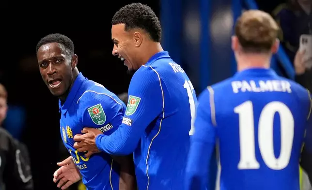 Chelsea's Danny Welbeck, left, celebrates after scoring his side's fourth goal during the English League Cup soccer match between FC Chelsea and Leeds United in London, Wednesday, Sept. 9, 2026. (Adam Davy/PA via AP)