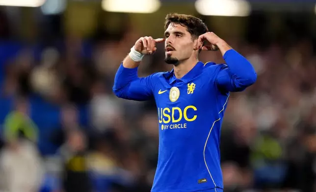 Chelsea's Pedro Neto celebrates after scoring his side's third goal during the English League Cup soccer match between FC Chelsea and Leeds United in London, Wednesday, Sept. 9, 2026. (Adam Davy/PA via AP)