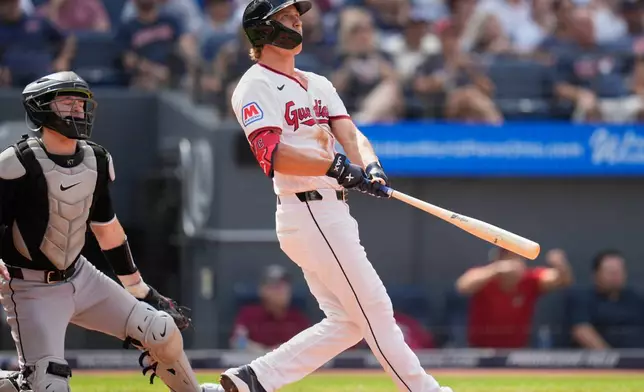 Cleveland Guardians' Petey Halpin, right, and catcher Kyle Teel, left, watch Halpin''s three-run home run in the sixth inning of a baseball game in Cleveland, Wednesday, Sept. 16, 2026. (AP Photo/Sue Ogrocki)