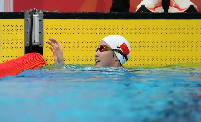 Yu Zidi of China waves after competing in the women's 200-meter individual medley final in swimming at the Asian Games in Tokyo, Japan, Monday, Sept. 21, 2026. (AP Photo/Hiro Komae)