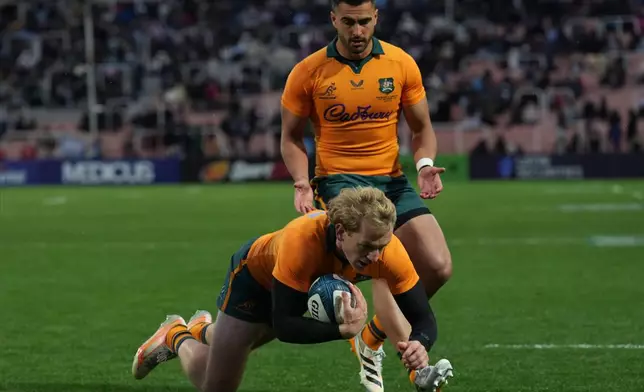 Australia's Max Jorgensen scores a try during a rugby test match against Argentina in Mendoza, Argentina, Saturday, Sept. 5, 2026. (AP Photo/Gustavo Garello)