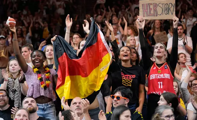 German fans cheer during the Women's Basketball World Cup semifinal match between France and Germany in Berlin, Saturday, Sept. 12, 2026. (AP Photo/Ebrahim Noroozi)