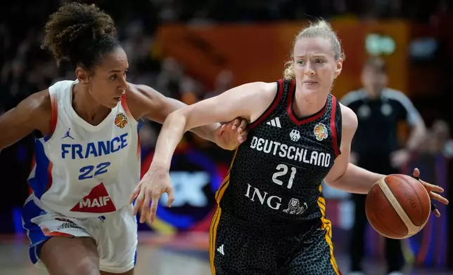 France's Marieme Badiane guards Germany's Marie Guelich during the Women's Basketball World Cup semifinal match between France and Germany in Berlin, Saturday, Sept. 12, 2026. (AP Photo/Ebrahim Noroozi)
