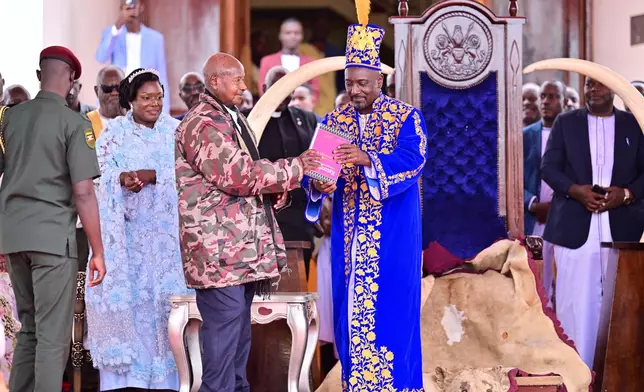 Journalist Edward Rukidi Kijanangoma, center, is coronated as king of Uganda's traditional Tooro Kingdom, in Fort Portal, Tuesday, Sept. 29, 2026. (AP Photo/Hajarah Nalwadda)