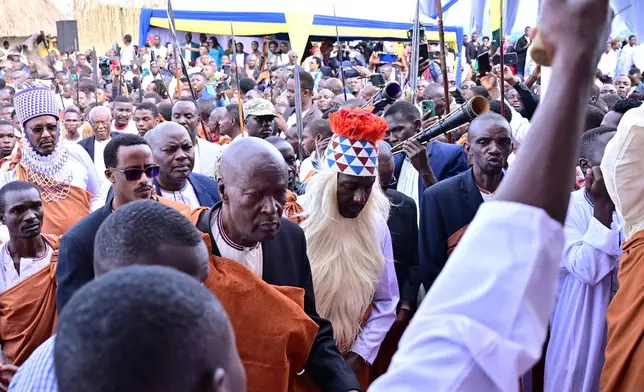 People arrive for coronation ceremony of journalist Edward Rukidi Kijanangoma as king of Uganda's traditional Tooro Kingdom, in Fort Portal, Tuesday, Sept. 29, 2026. (AP Photo/Hajarah Nalwadda)