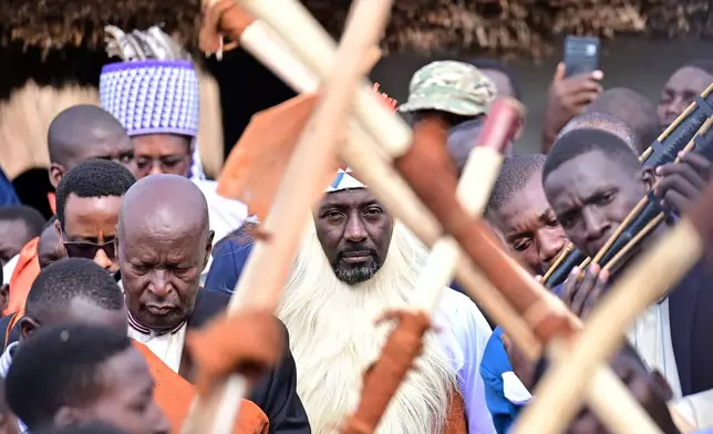 Journalist Edward Rukidi Kijanangoma, center, walks during his coronation as king of Uganda's traditional Tooro Kingdom, in Fort Portal, Tuesday, Sept. 29, 2026. (AP Photo/Hajarah Nalwadda)