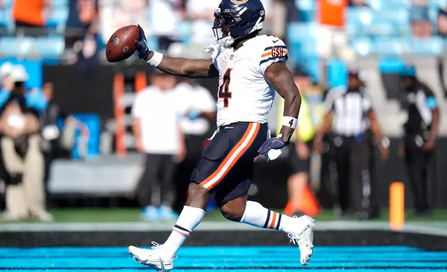 Chicago Bears running back D'Andre Swift (4) scores a touchdown during the second half of an NFL football game, Sunday, Sept. 13, 2026, in Charlotte, N.C. (AP Photo/Erik Verduzco)