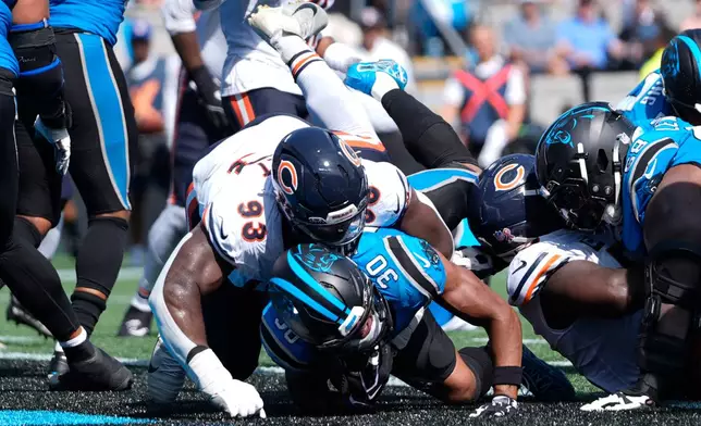 Carolina Panthers running back Chuba Hubbard (30) scores a touchdown during the second half of an NFL football game, Sunday, Sept. 13, 2026, in Charlotte, N.C. (AP Photo/Erik Verduzco)
