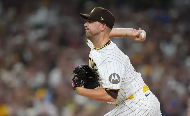 San Diego Padres pitcher Michael King (34) throws in the first inning of Game 1 of the National League Wild Card baseball playoff series against the Chicago Cubs Tuesday, Sept. 29, 2026, in San Diego. (AP Photo/Gregory Bull)