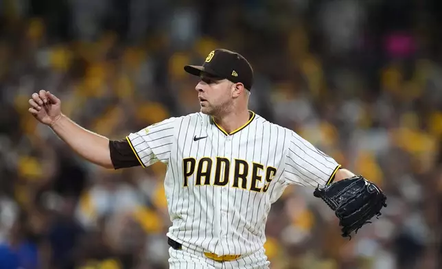 San Diego Padres pitcher Michael King delivers against the Chicago Cubs in the sixth inning of Game 1 of the National League Wild Card baseball playoff series Tuesday, Sept. 29, 2026, in San Diego. (AP Photo/Gregory Bull)