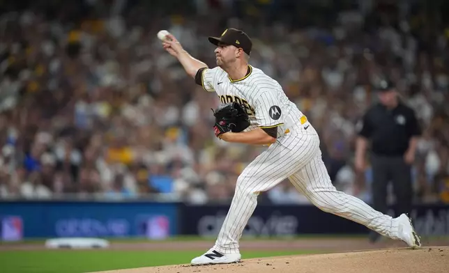 San Diego Padres pitcher Michael King (34) throws in the first inning of Game 1 of the National League Wild Card baseball playoff series against the Chicago Cubs Tuesday, Sept. 29, 2026, in San Diego. (AP Photo/Gregory Bull)