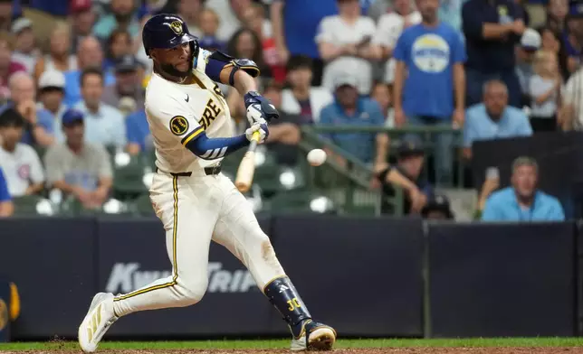 Milwaukee Brewers' Jackson Chourio hits a two-run home during the ninth inning of a baseball game against the Chicago Cubs, Tuesday, Sept. 8, 2026, in Milwaukee. (AP Photo/Aaron Gash)
