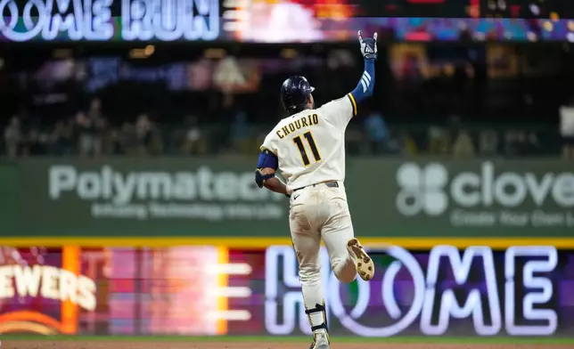 Milwaukee Brewers' Jackson Chourio gestures as he rounds the bases after hitting a two-run home during the ninth inning of a baseball game against the Chicago Cubs, Tuesday, Sept. 8, 2026, in Milwaukee. (AP Photo/Aaron Gash)