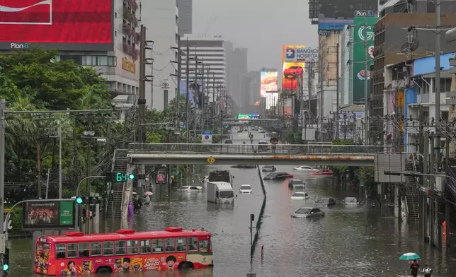 The streets are flooded after heavy rain in Bangkok, Thailand, Saturday, Sept. 26, 2026. (AP Photo/Sakchai Lalit)