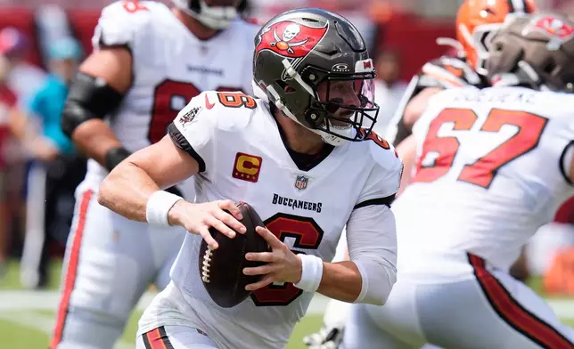 Tampa Bay Buccaneers quarterback Baker Mayfield (6) runs with the football during the first half of an NFL football game against the Cleveland Browns in Tampa, Fla., Sunday, Sept. 20, 2026. (AP Photo/Chris O'Meara)