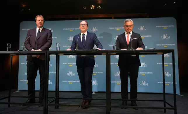 German Interior Minister Alexander Dobrindt, center, European Commissioner for Internal Affairs and Migration, Magnus Brunner, right, and Minister for Justice, Home Affairs and Migration Jim O'Callaghan, left, brief the media before the Munich Migration Meeting in Munich, Germany, Saturday, Sept. 26, 2026. (AP Photo/Matthias Schrader)