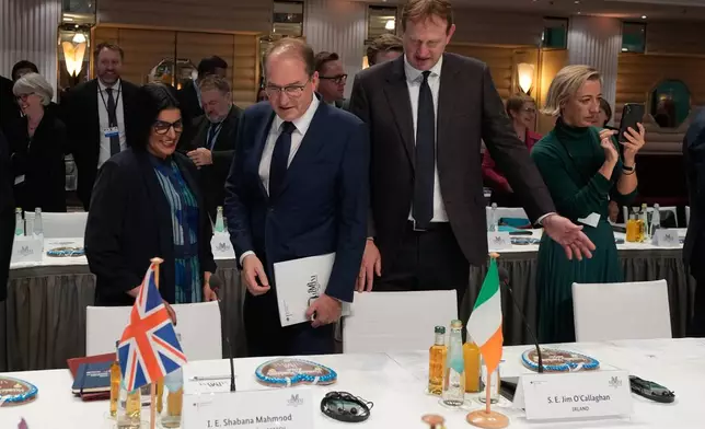 German Interior Minister Alexander Dobrindt, center, Minister for Justice Jim O'Callaghan, right, and Britain Home Secretary Shabana Mahmood arrive for the Munich Migration Meeting in Munich, Germany, Saturday, Sept. 26, 2026. (AP Photo/Matthias Schrader)