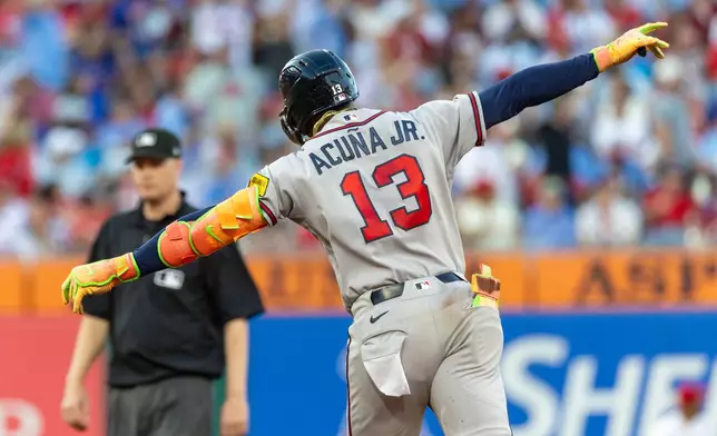 Atlanta Braves' Ronald Acuña Jr. (13) gestures as he runs the bases after hitting a solo home run in the third inning of a baseball game against the Philadelphia Phillies, Saturday, Sept. 5, 2026, in Philadelphia. (AP Photo/Laurence Kesterson)