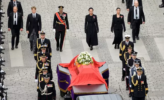 Norway's Prince Sverre Magnus, from 2nd left, King Haakon VIII, Crown Princess Ingrid Alexandra and Princess Märtha Louise walk behind the coffin of King Harald V during a procession from the Royal Palace to Oslo Cathedral, in Oslo, Norway, Wednesday, Sept. 9, 2026. (Cornelius Poppe/Pool Photo via AP)