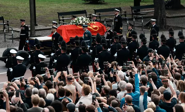 The coffin of Norway's King Harald V is followed in the procession route for his funeral as it arrives at Oslo Cathedral in Oslo, Wednesday, Sept. 9, 2026. (AP Photo/Markus Schreiber)