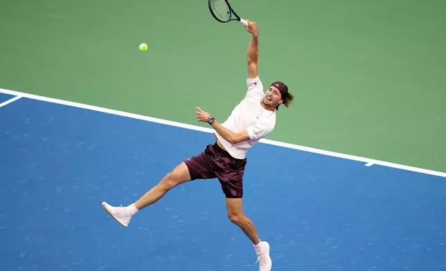 Alexander Zverev, of Germany, returns the ball to Karen Khachanov, of Russia, during the men's singles semifinals of the U.S. Open tennis championships Friday, Sept. 11, 2026, in New York. (AP Photo/Frank Franklin II)