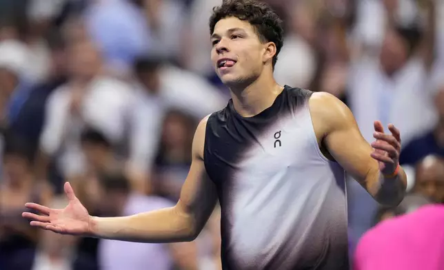 Ben Shelton, of the United States, reacts after he won his match against Frances Tiafoe, of the United States, during the men's singles semifinals of the U.S. Open tennis championships Friday, Sept. 11, 2026, in New York. (AP Photo/Frank Franklin II)
