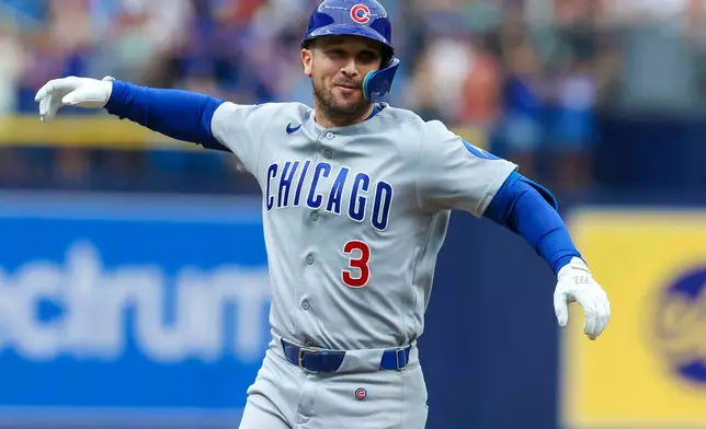 Chicago Cubs designated hitter Alex Bregman celebrates his two-run home run in the first inning of a baseball game against the Boston Red Sox, Sunday, Sept. 27, 2026, in St. Petersburg, Fla. (AP Photo/Chris Urso)