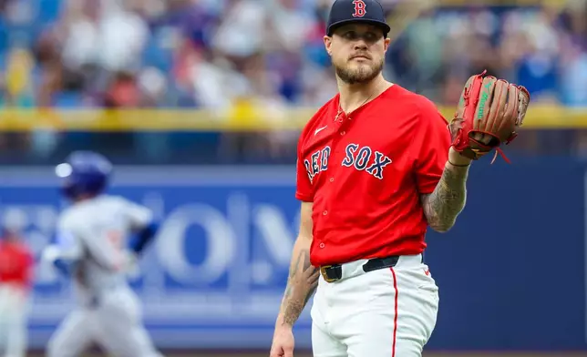 Boston Red Sox starting pitcher Tanner Houck looks on after giving up a two-run home run to Chicago Cubs designated hitter Alex Bregman during the first inning of a baseball game Sunday, Sept. 27, 2026, in St. Petersburg, Fla. (AP Photo/Chris Urso)